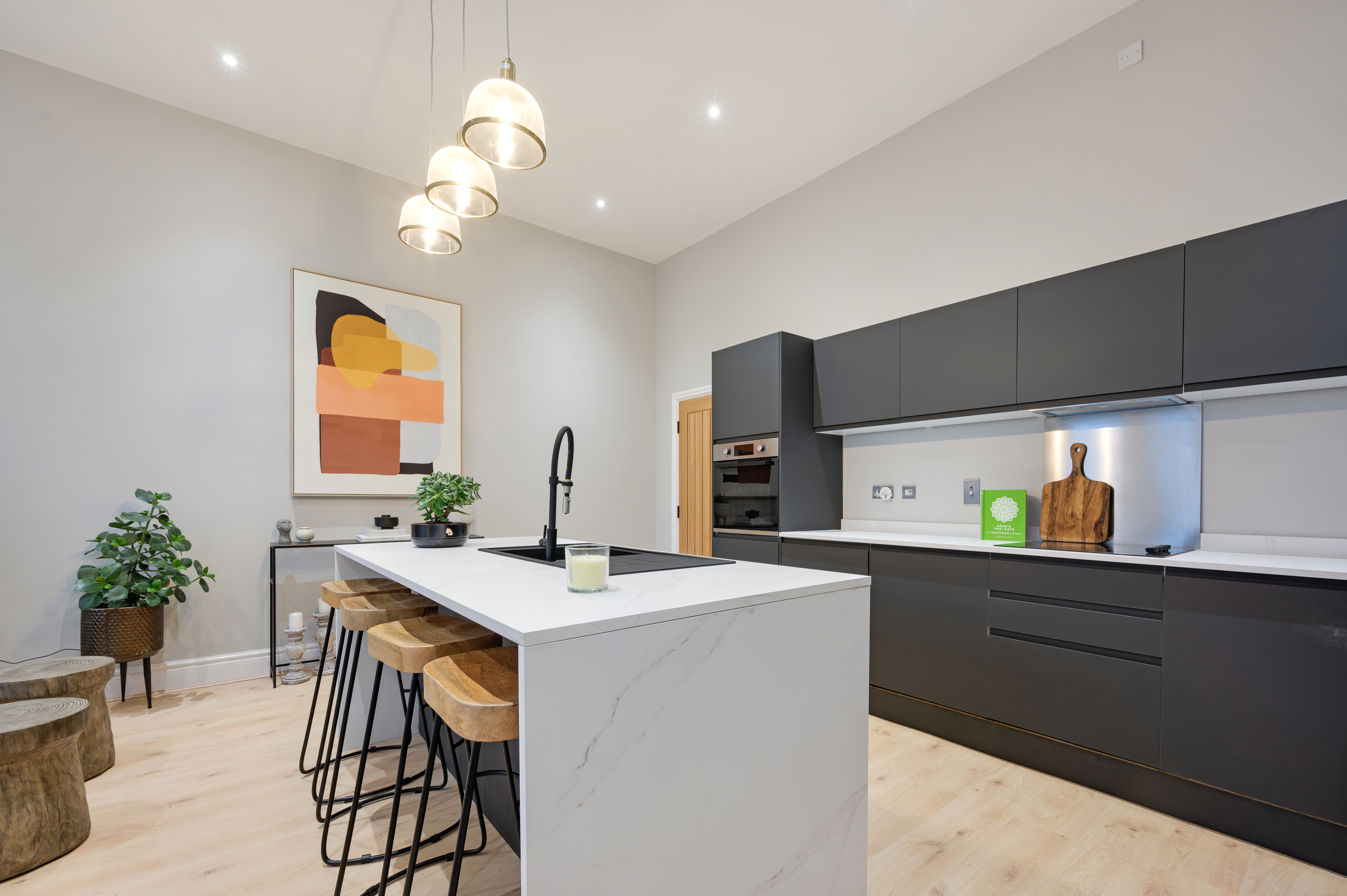 Aethos Homes - kitchen with statement artwork